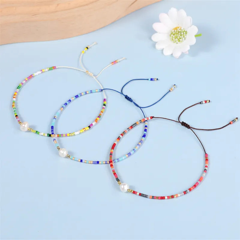 Pulseras  de colores con Perla